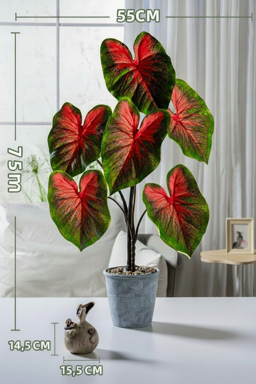 Kunstig grønn plante i potte