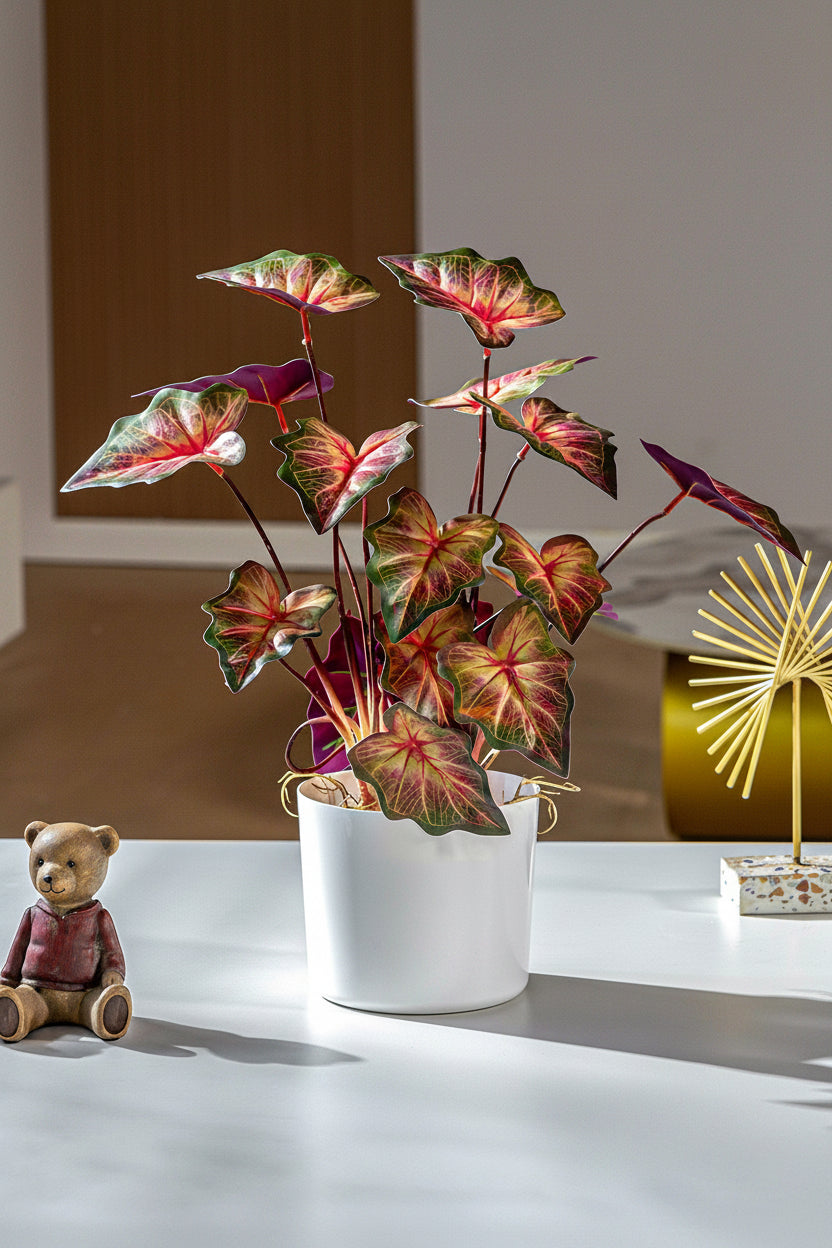 Kunstig grønn plante i potte