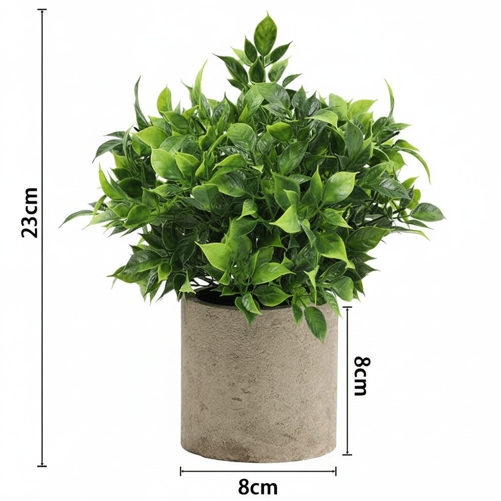Kunstig grønn plante i dekorativ potte