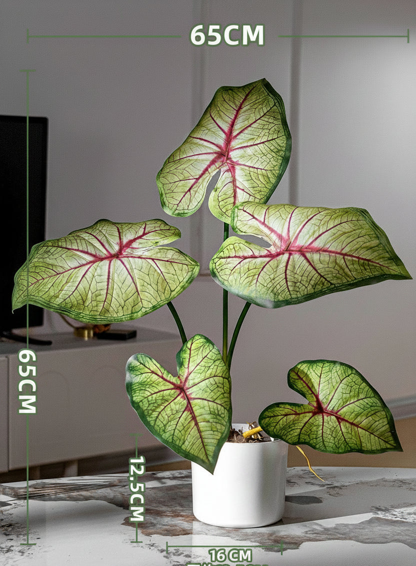 Kunstig grønn plante i potte