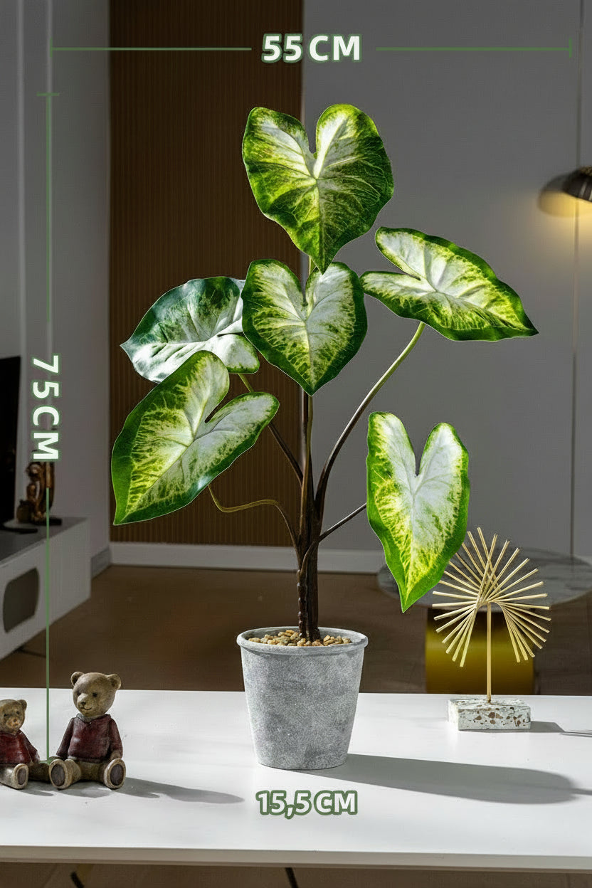 Kunstig grønn plante i potte