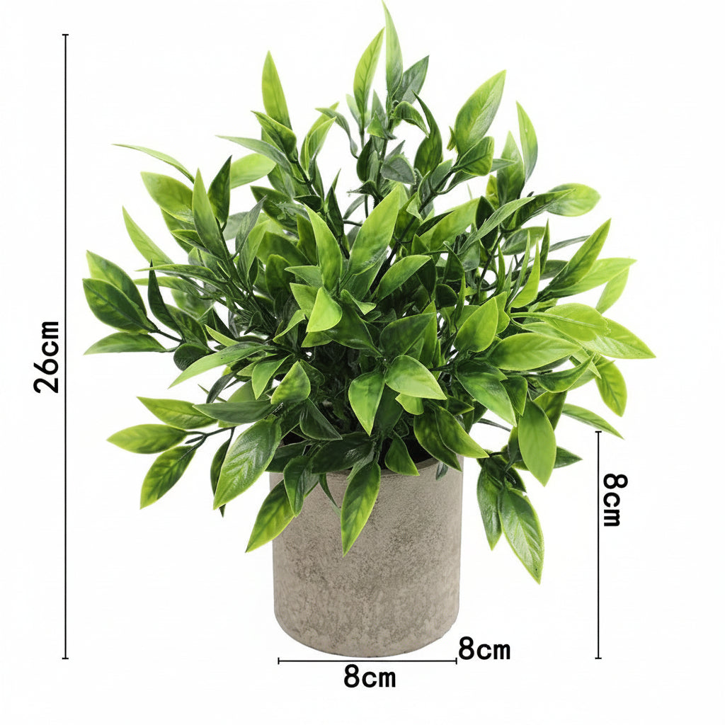 Kunstig grønn plante i dekorativ potte