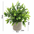 Kunstig grønn plante i dekorativ potte