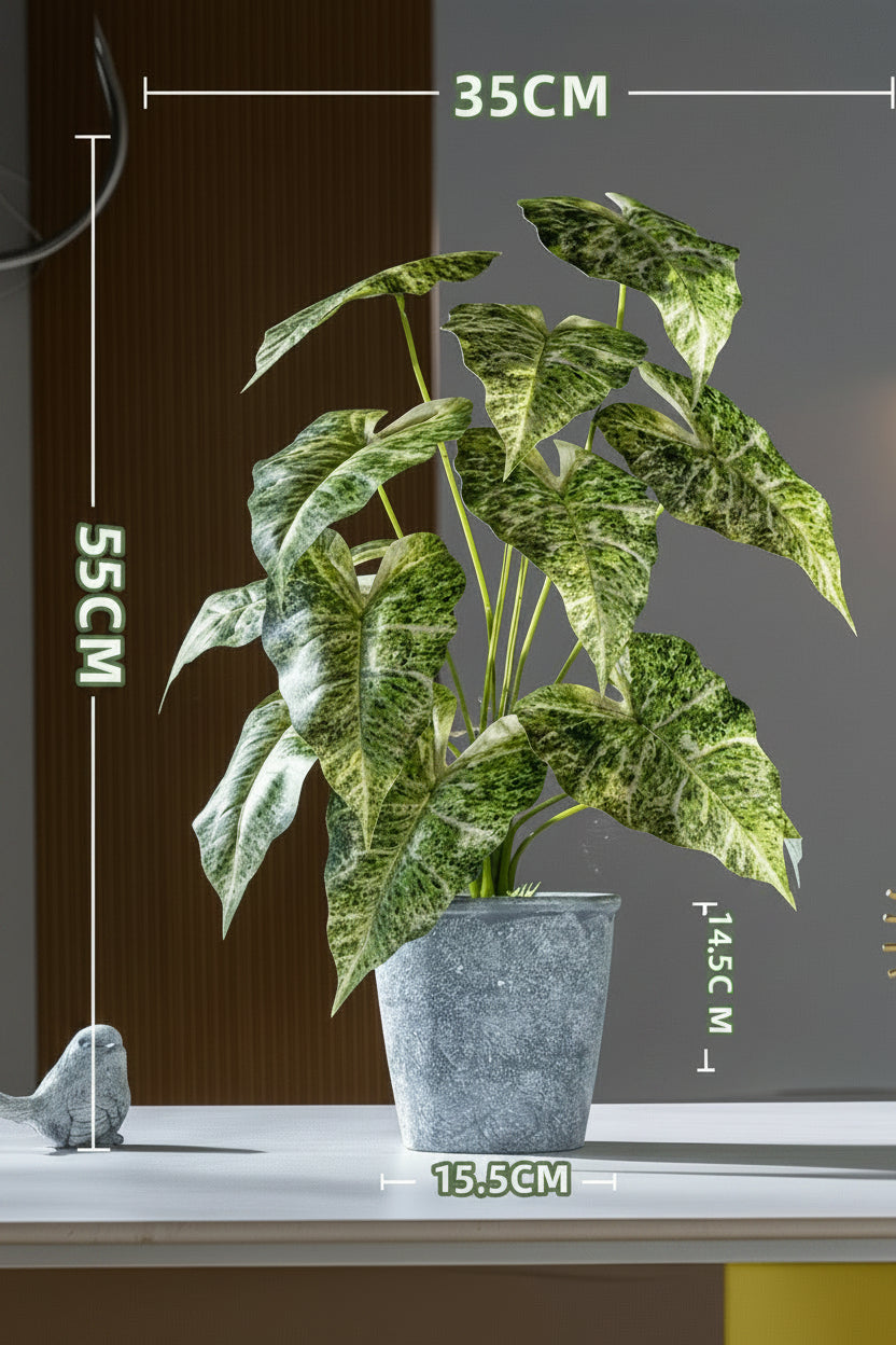 Kunstig grønn plante i potte