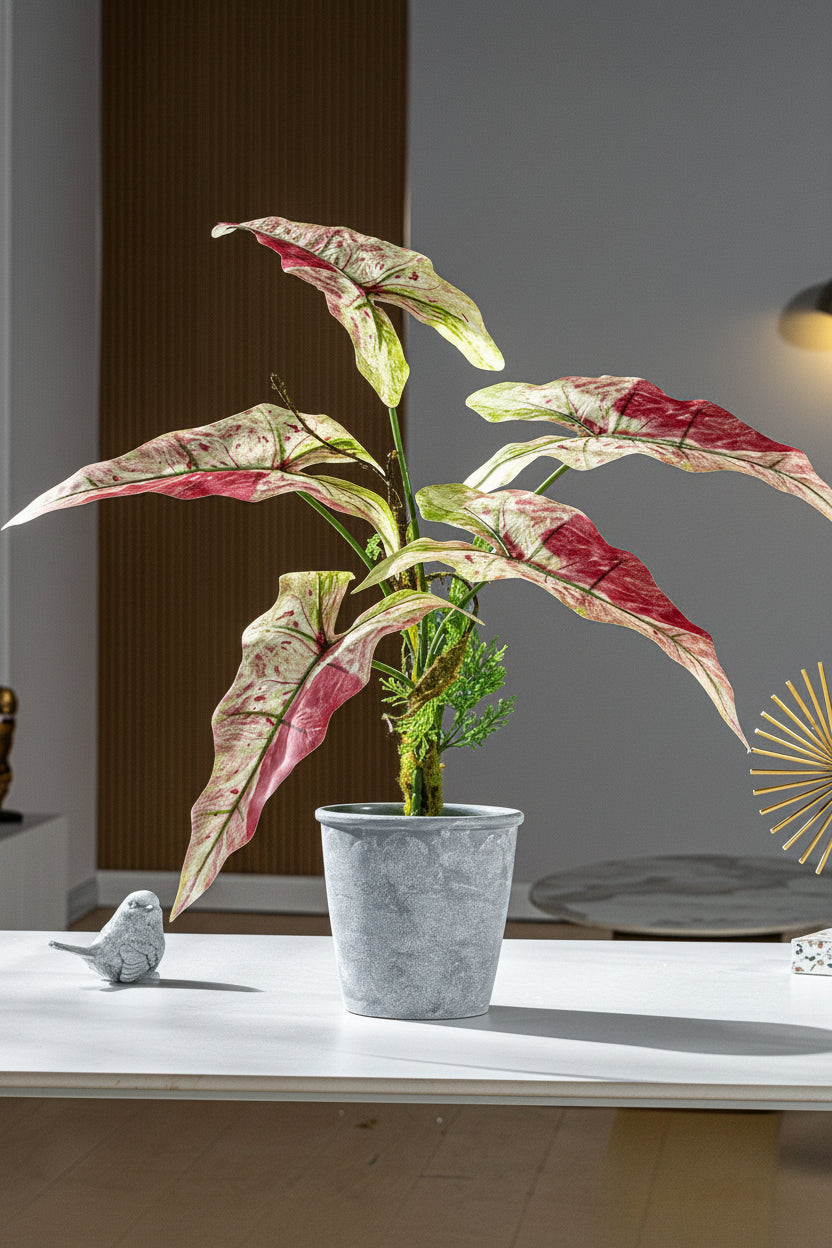 Kunstig grønn plante i potte