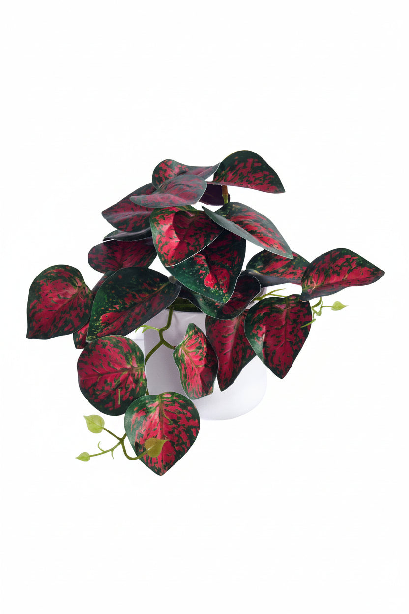 Kunstig grønn plante i potte