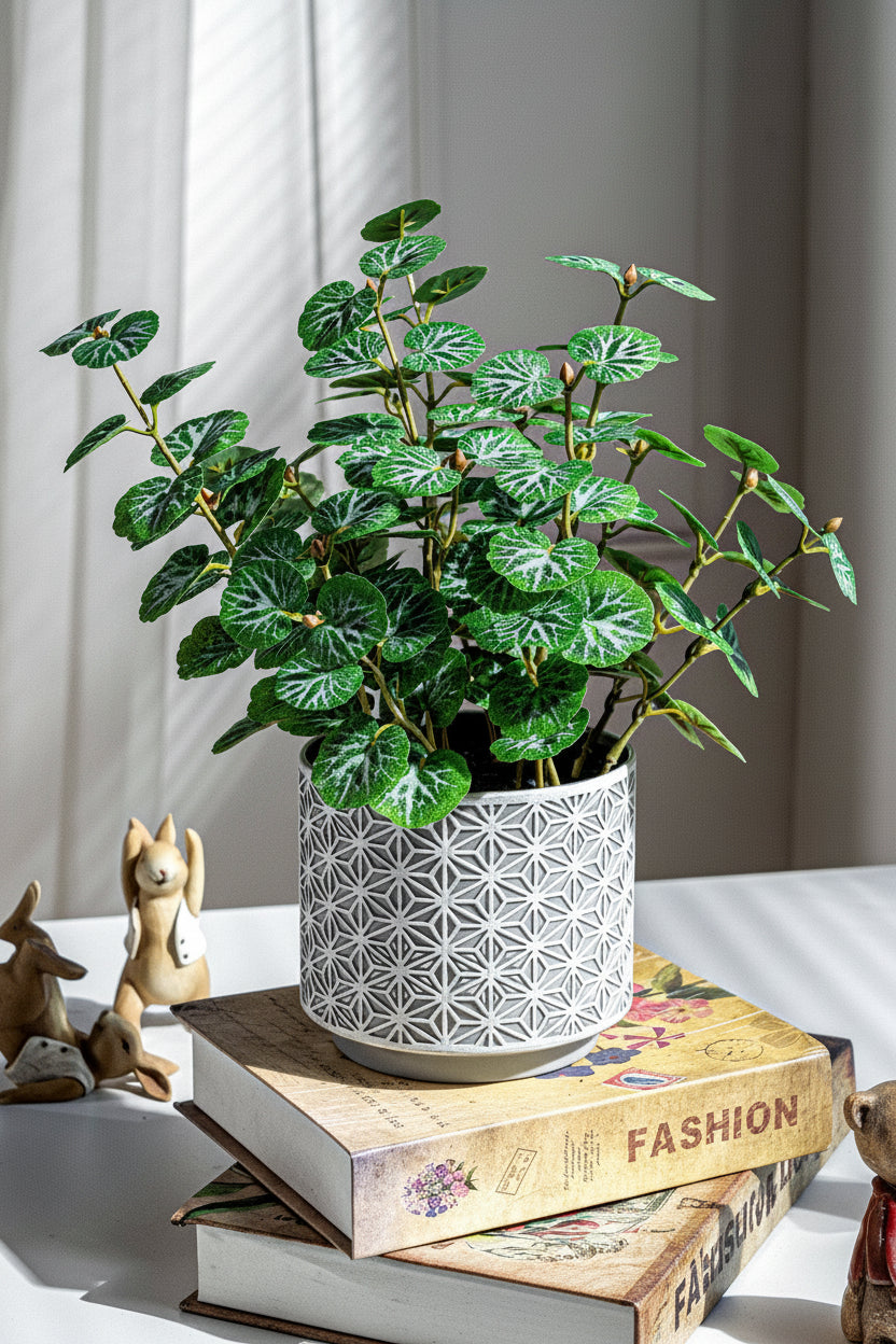 Kunstig grønn plante i potte