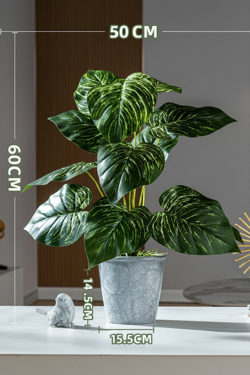 Kunstig grønn plante i potte