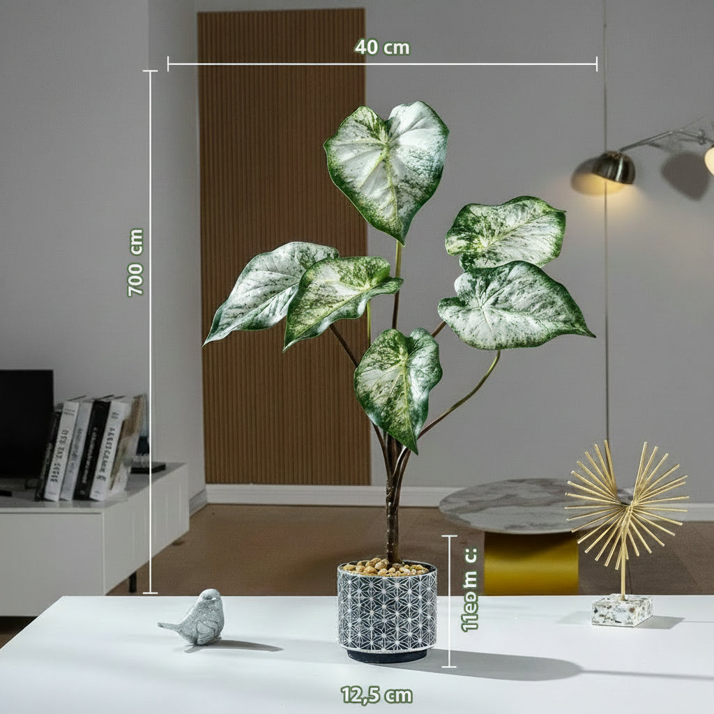 Kunstig grønn plante i potte