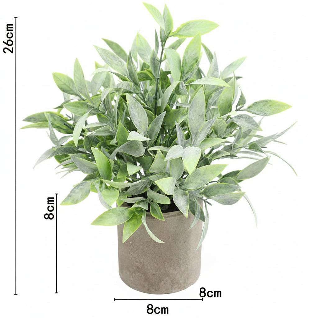Kunstig grønn plante i dekorativ potte