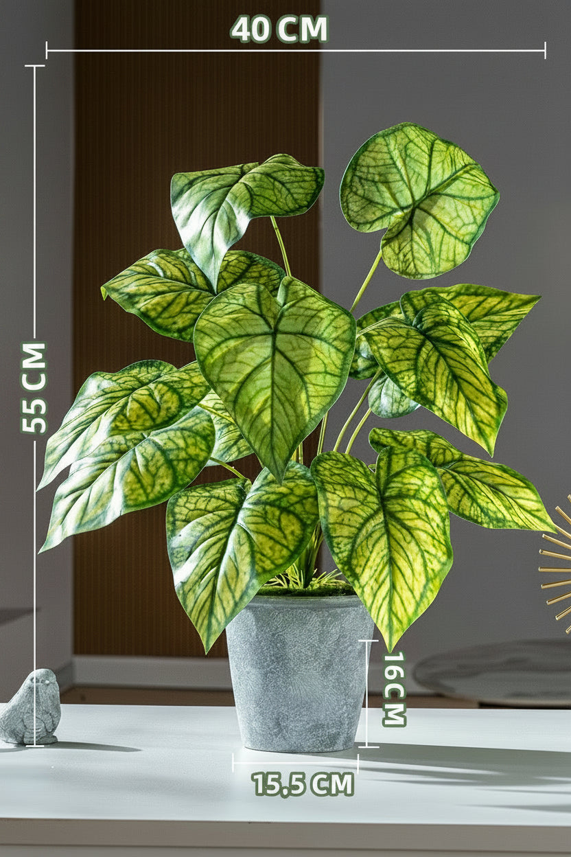 Kunstig grønn plante i potte