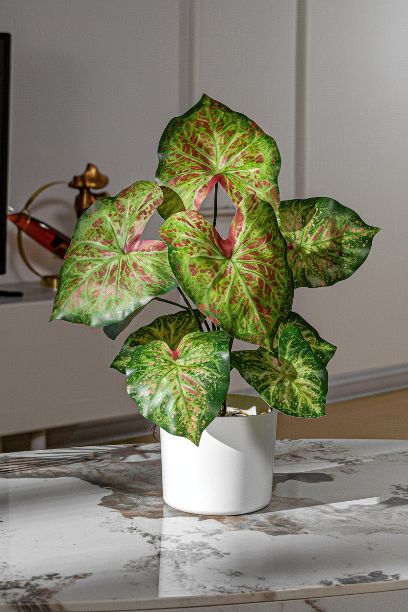 Kunstig grønn plante i potte