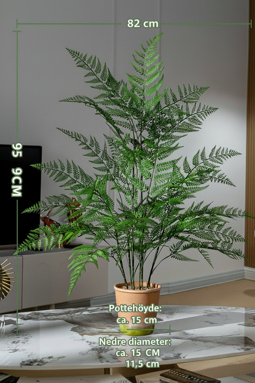 Kunstig grønn plante i potte