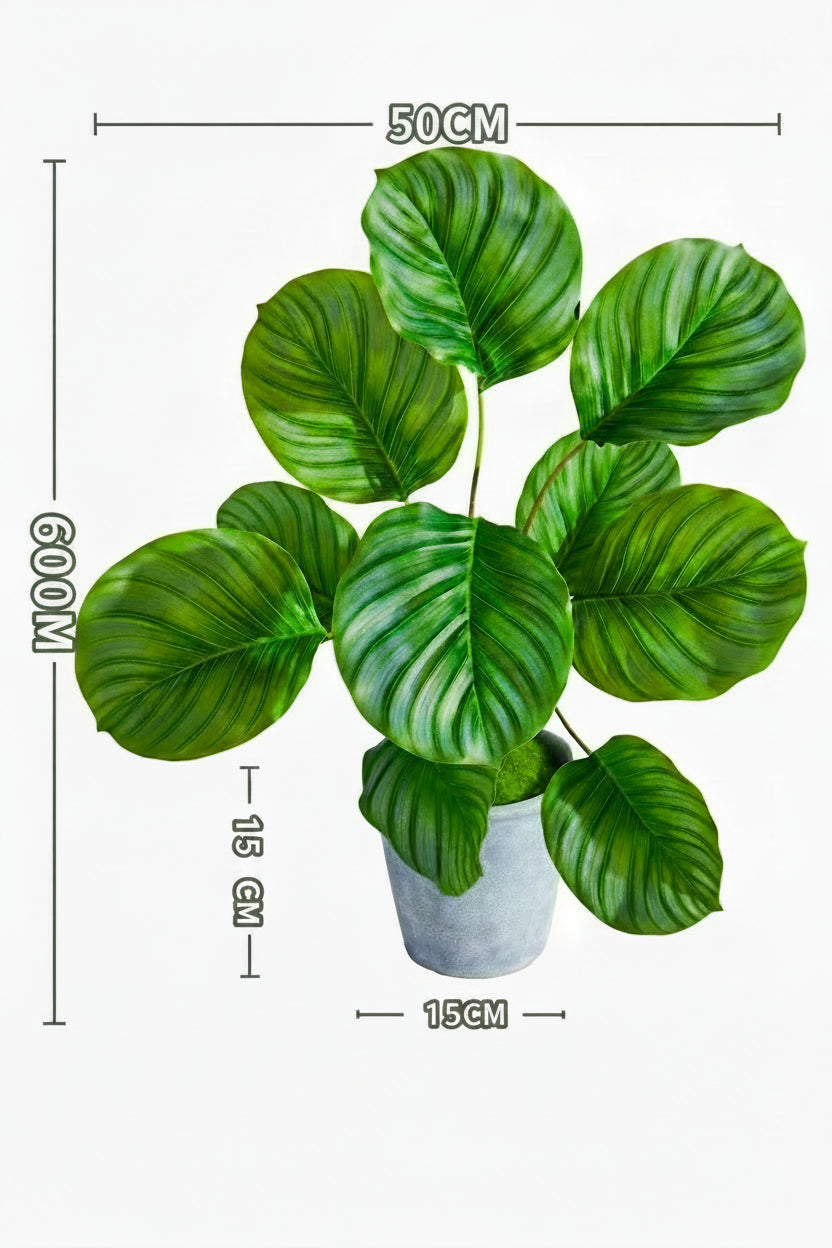 Kunstig grønn plante i potte